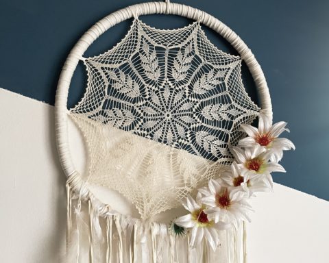 Dreamcatcher on wall over bed, decorated bed room with Native American decoration
