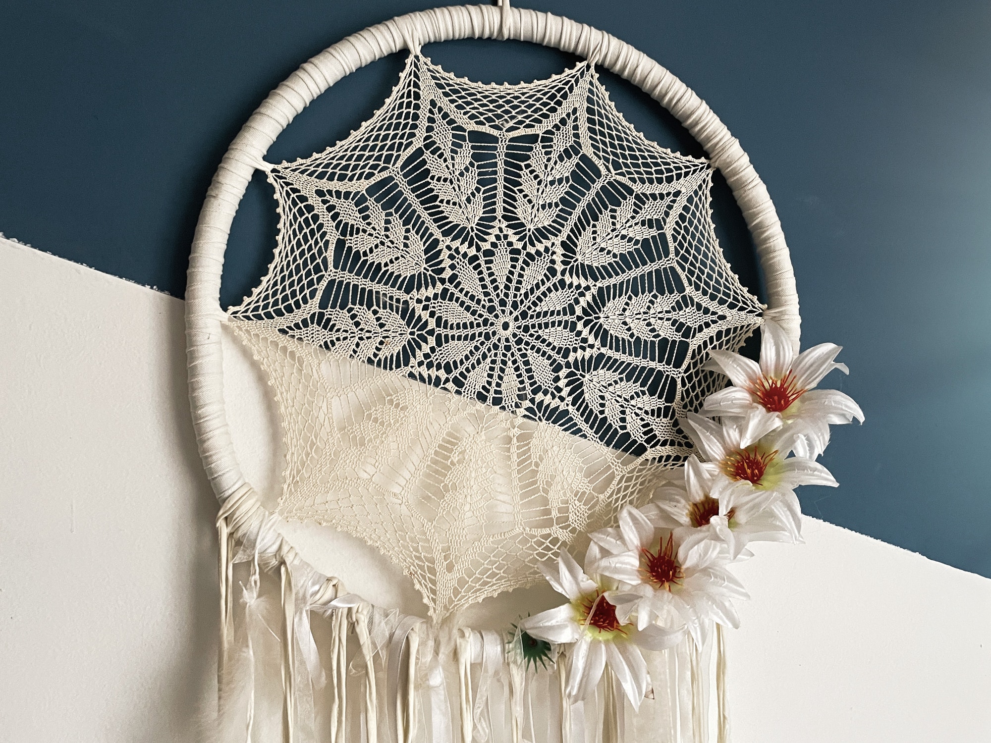 Dreamcatcher on wall over bed, decorated bed room with Native American decoration
